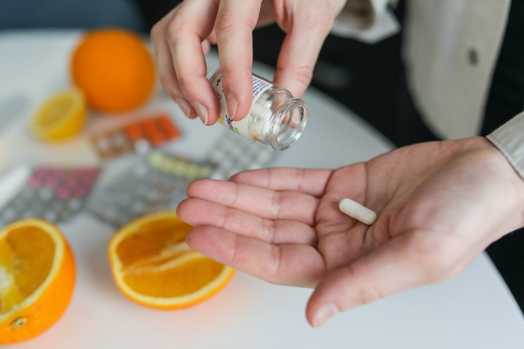 vitamin pill in an open hand